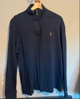 The listing photo: a navy Ralph Lauren quarter-zip on a hanger
