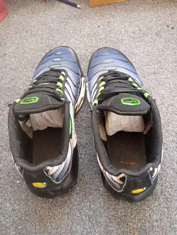 Before: trainers photographed on a bedroom carpet in flat light