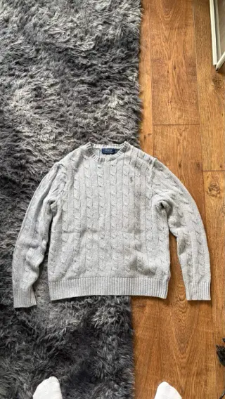 The original phone photo of a knit and jeans