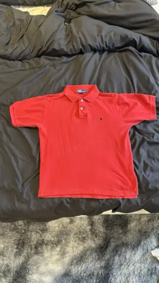 The original phone photo of a red polo