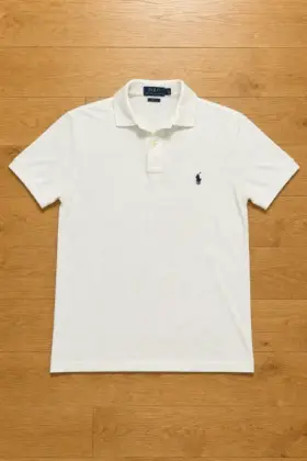 A polo rendered by Reframe, Flat Lay — Front layout