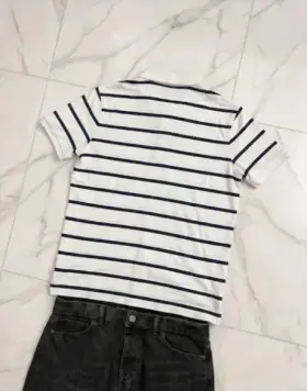 A polo rendered by Reframe, On Jeans — Back layout